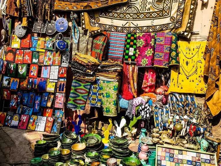 Colorful Mexican market stall filled with crafts, textiles and pottery — dos and don'ts of bartering in Mexico
